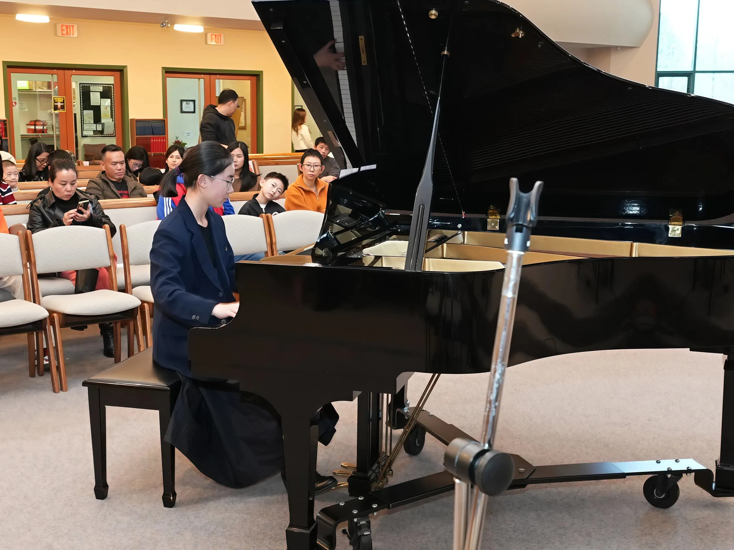 Piano performance at Reindeer Education's 2026 public gallery.