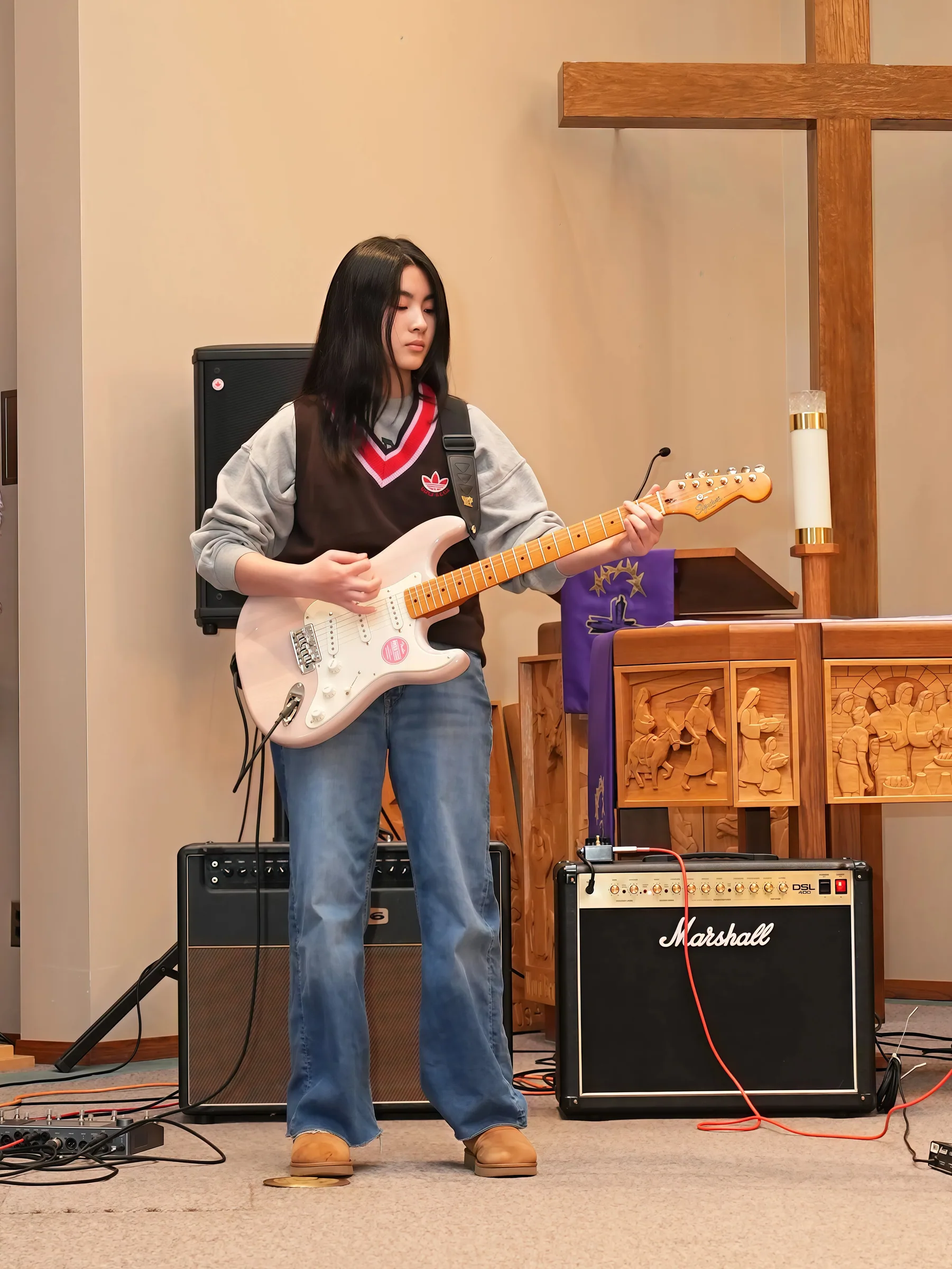 Guitar performance at Reindeer Education's 2026 public gallery.