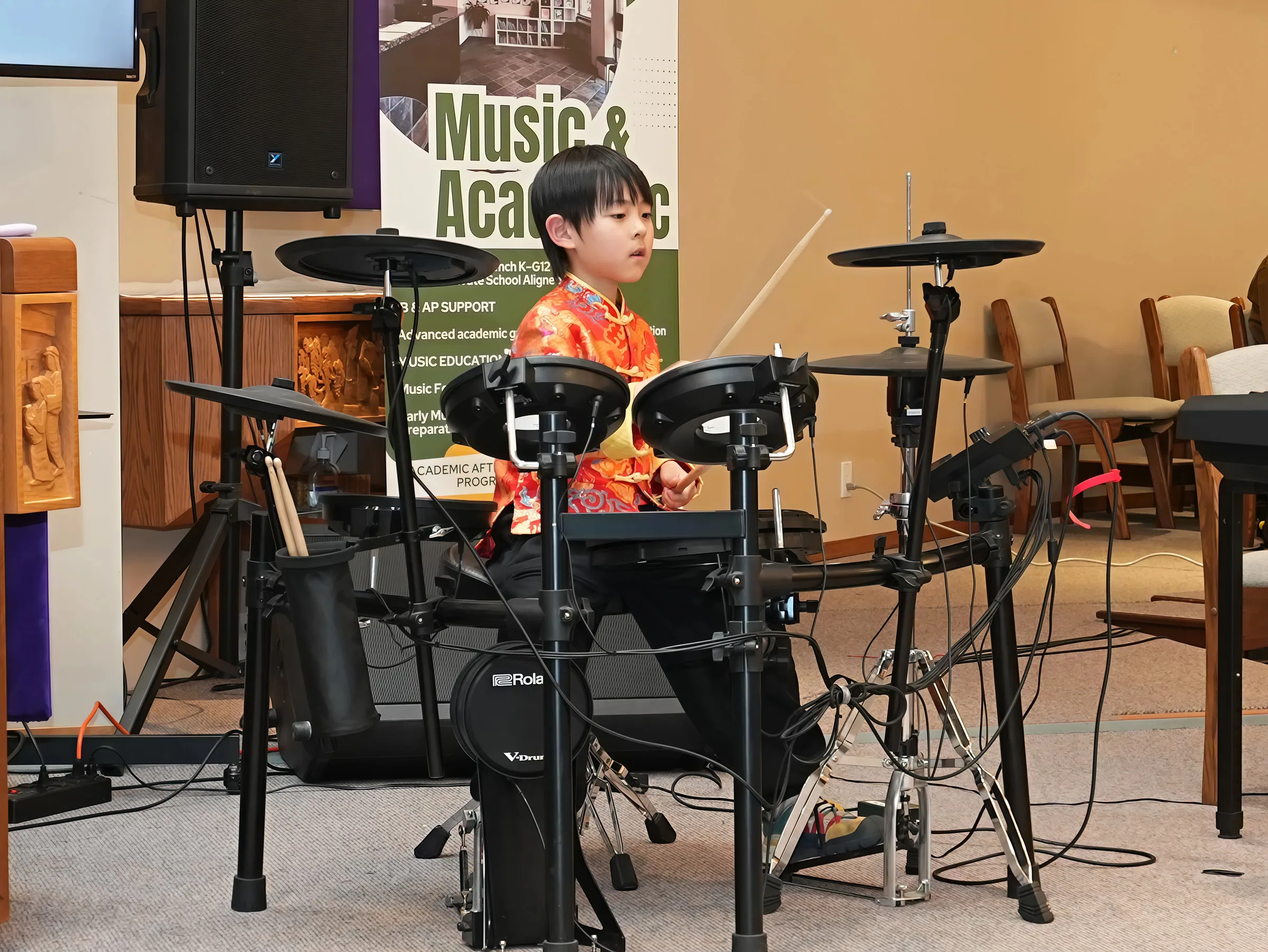 Student performance moment from Reindeer Education's 2026 public gallery.